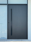 matt black 1800mm entry door pull handle set in a urban style finish, installed on a black door 