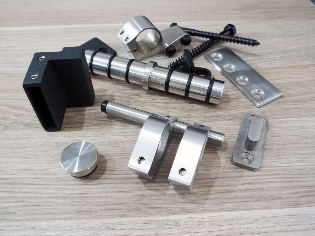 Set of metal hardware accessories components on a wooden surface