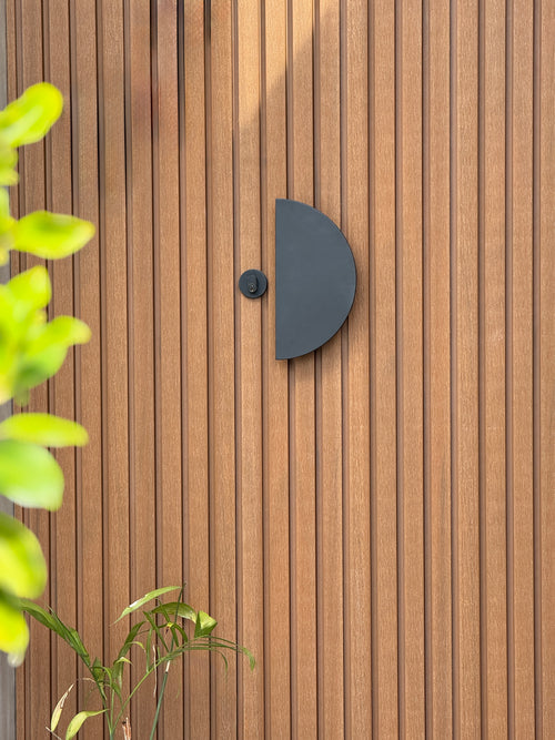 ZMTONLINE Modern timber door featuring a Matt Black Mezzaluna pull handle and Round mortice lock.