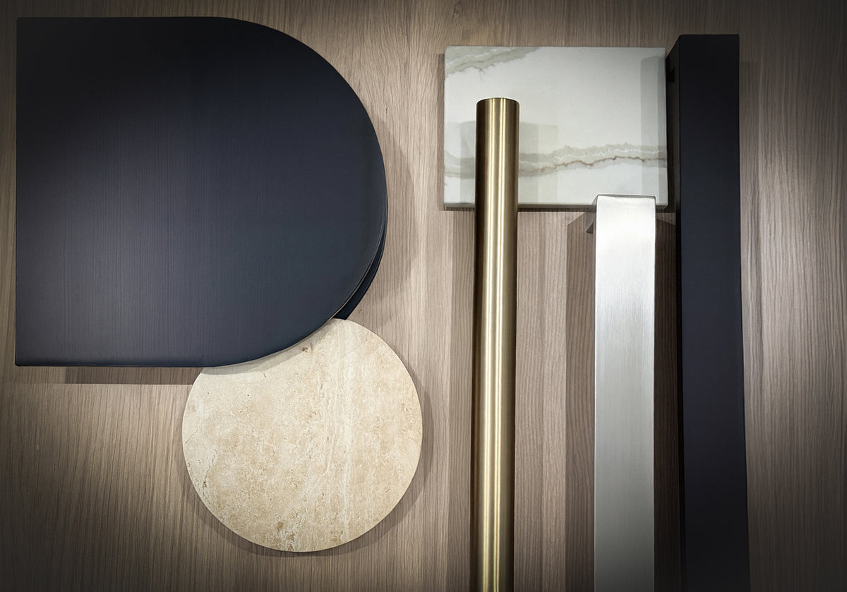 Wooden background with brushed brass, matt black and stone entry pull handles
