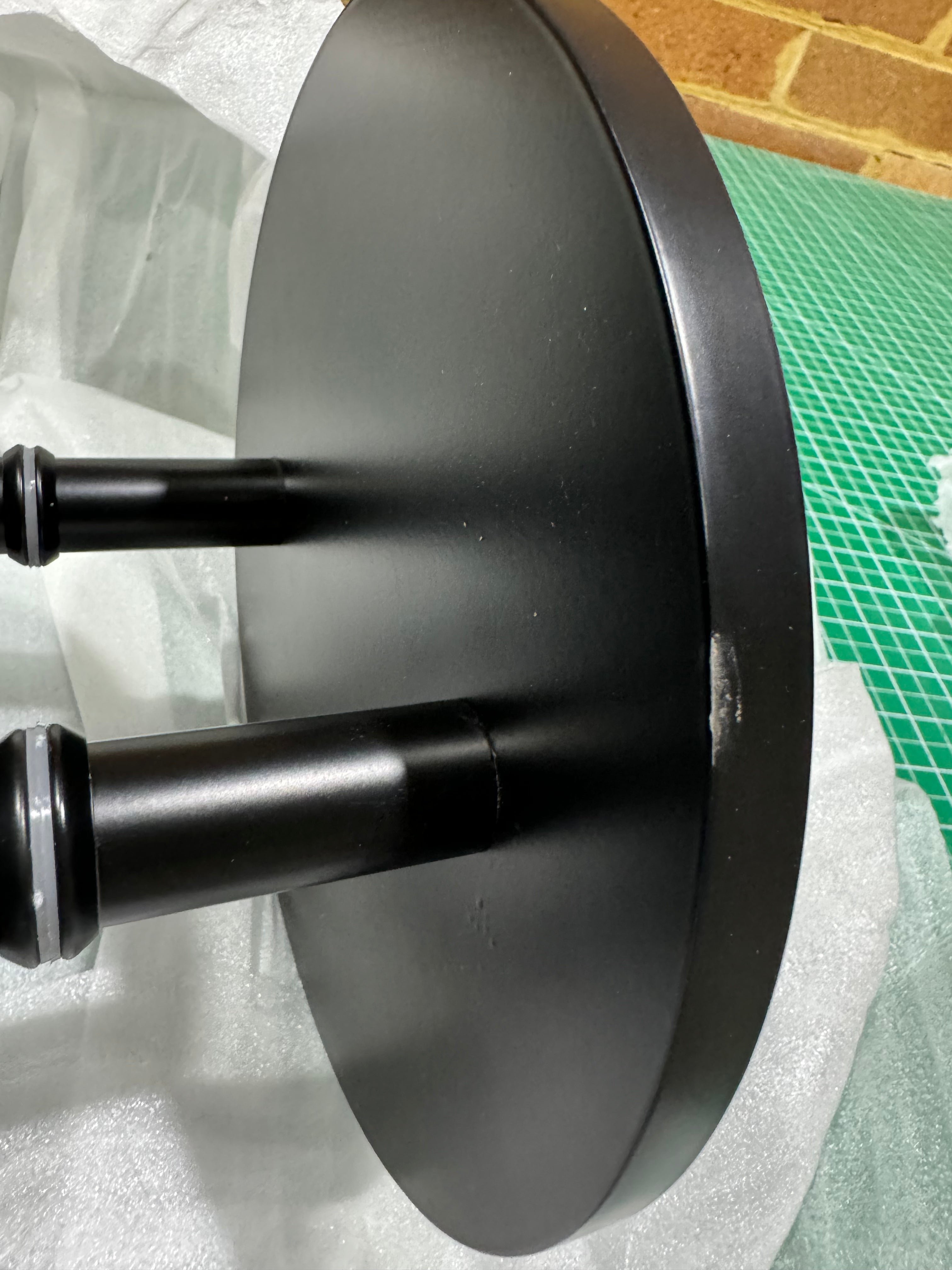Pair of matt black round Rhondo 220 entry door pull handles viewed from the top side