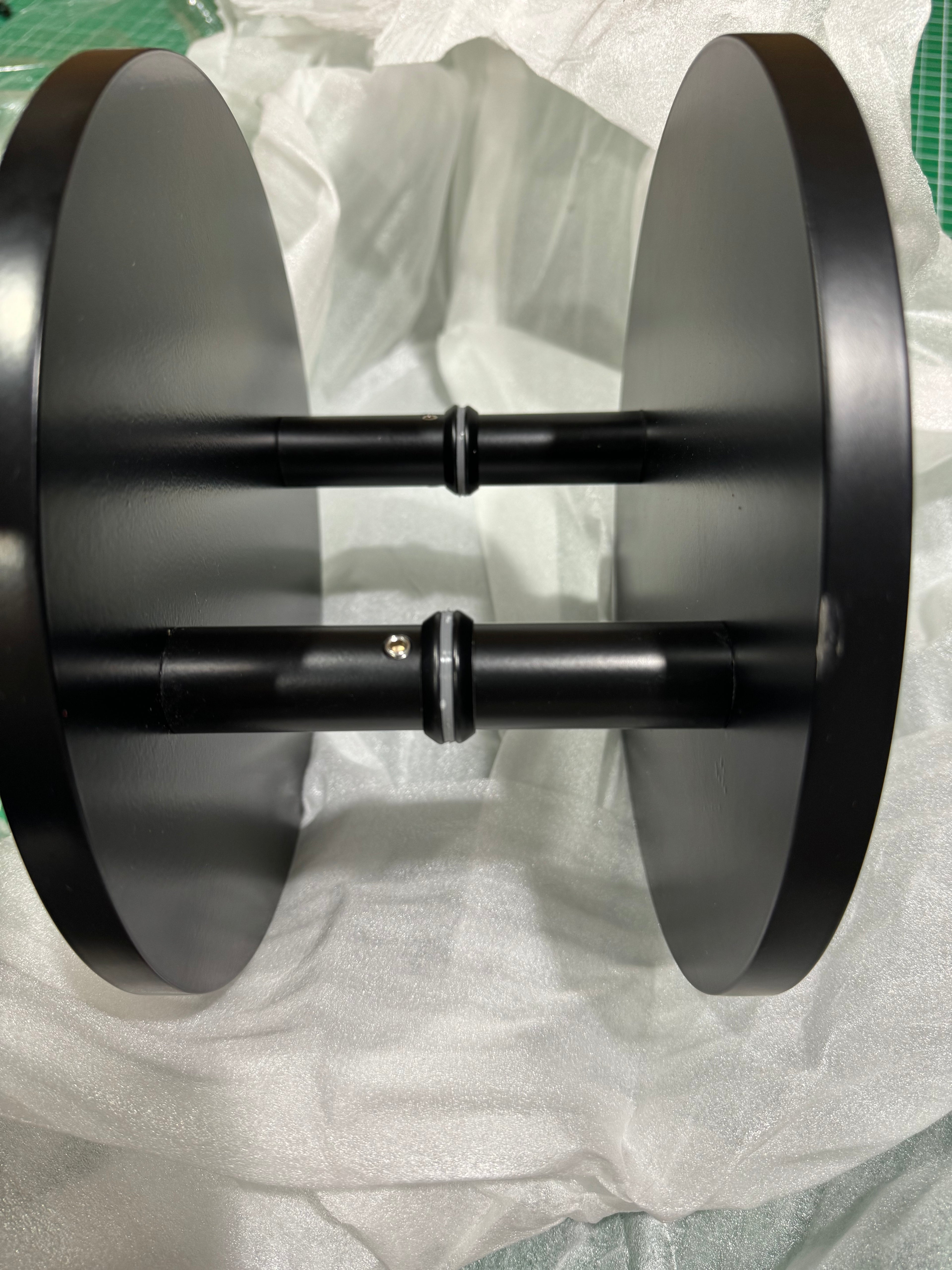 Pair of matt black round Rhondo 220 entry door pull handles viewed from the top
